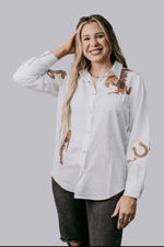 Western cut out embroidery pearl snap button down shirt.